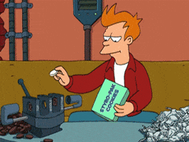 Fry from Futurama dunking a cookie into a vice full of crushed cookies, captioned 'What'